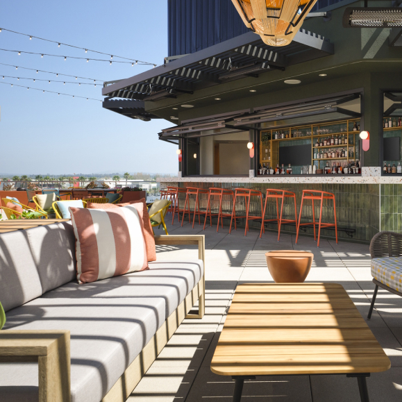 a patio with a bar and a couch