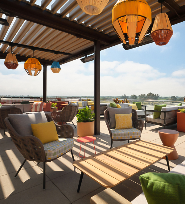 a patio with chairs and tables