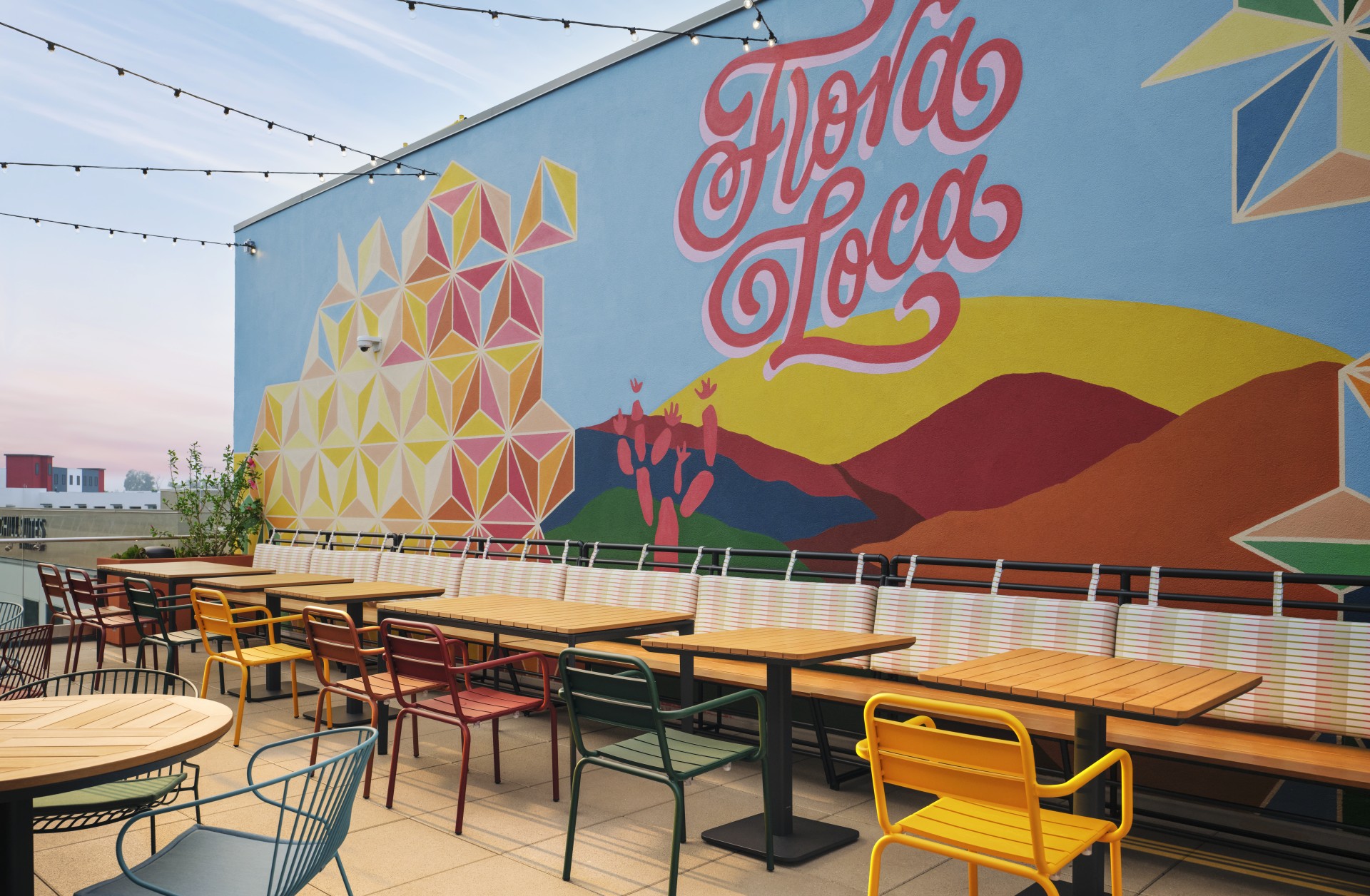 a wall with tables and chairs