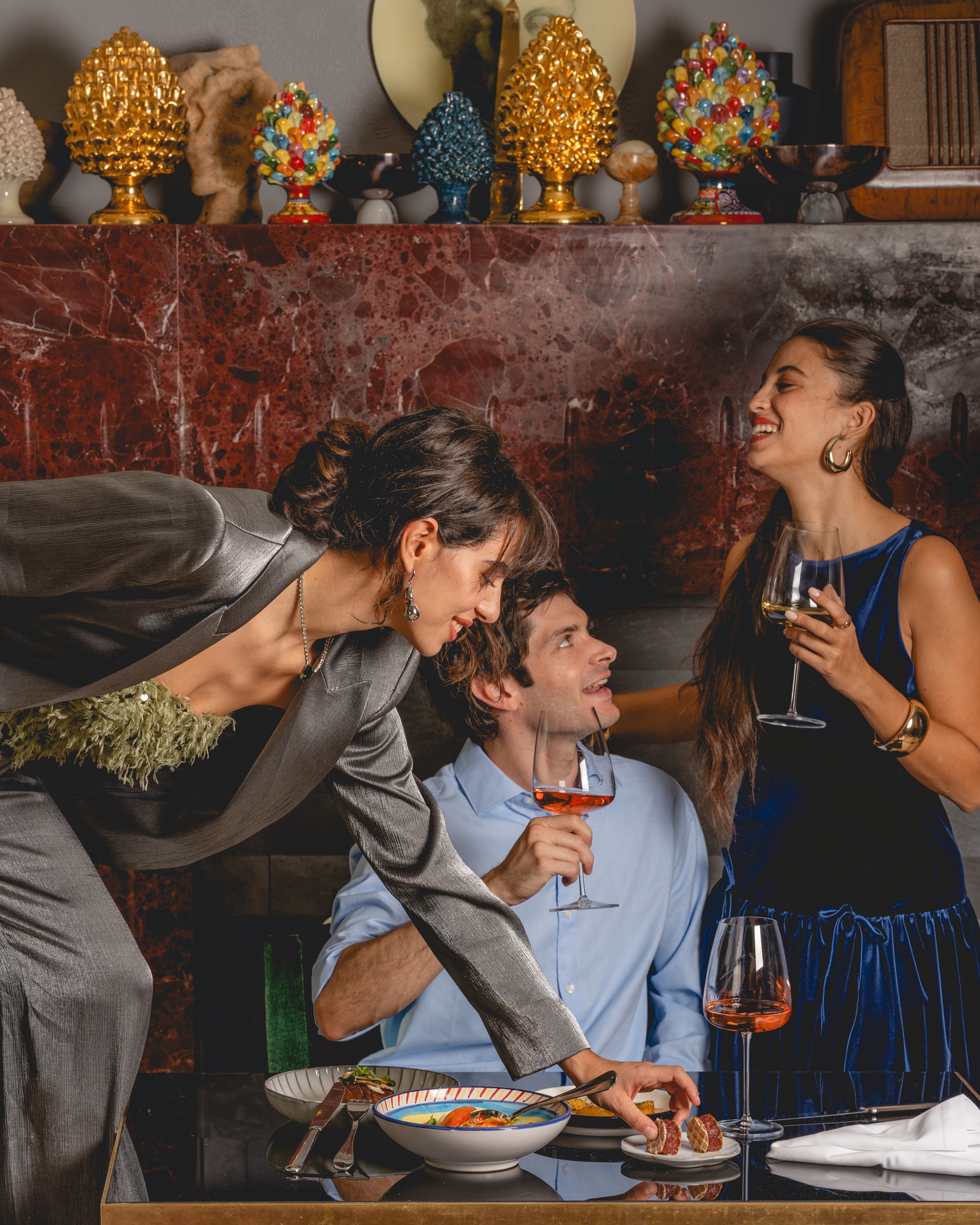 a group of people drinking wine