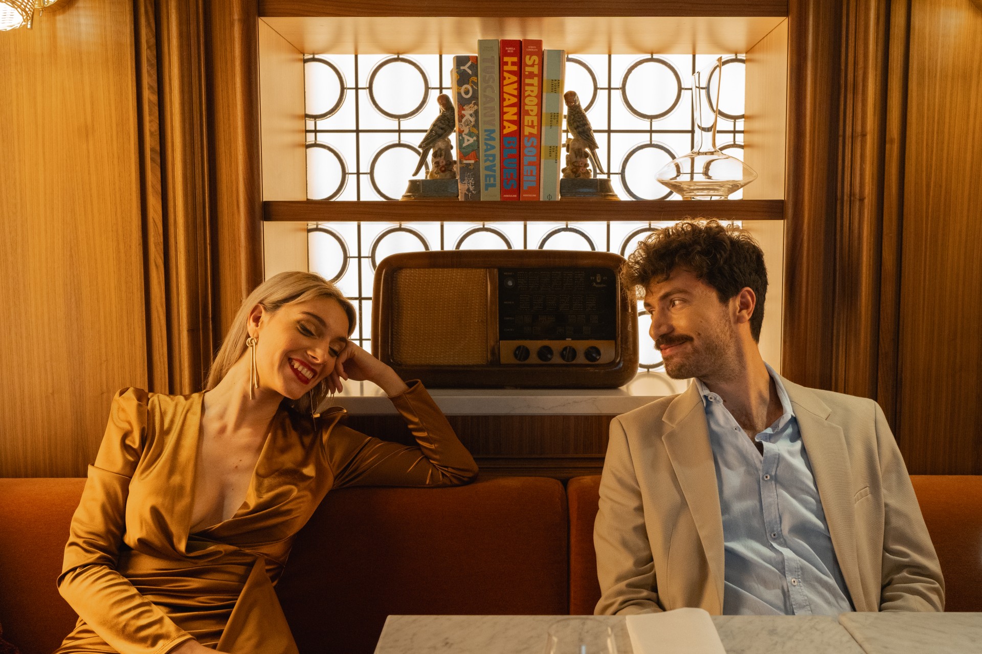 a man and woman sitting at a table