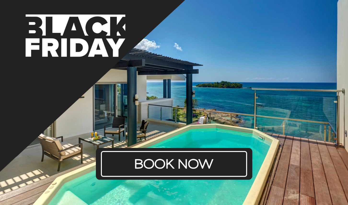 a pool with a deck overlooking a body of water