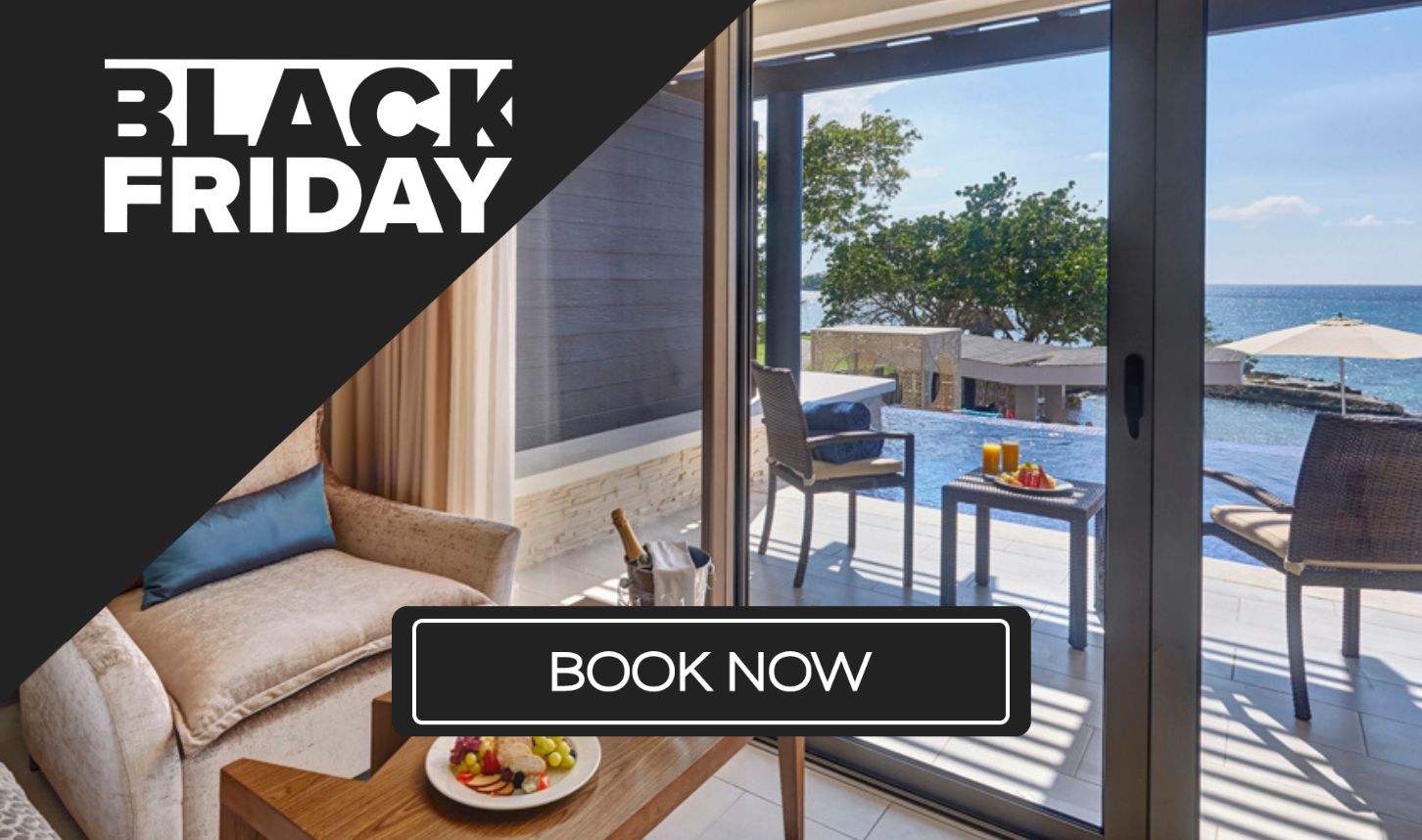 a room with a glass door and a couch