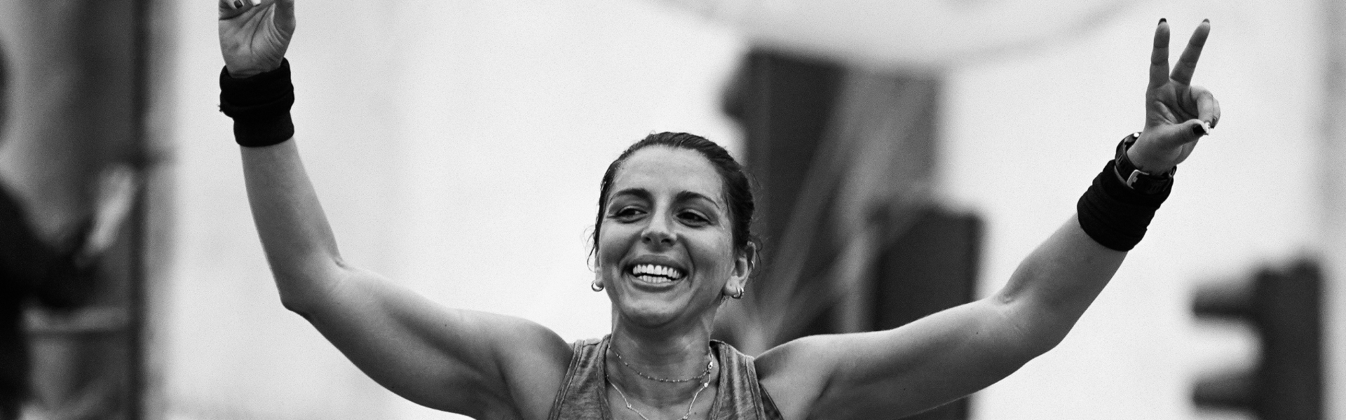 a woman smiling with her arms out