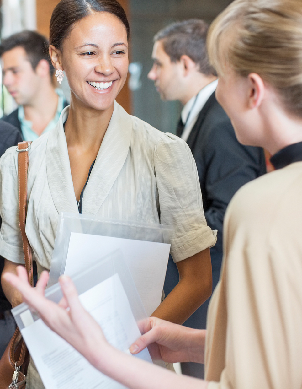 a woman holding a piece of paper