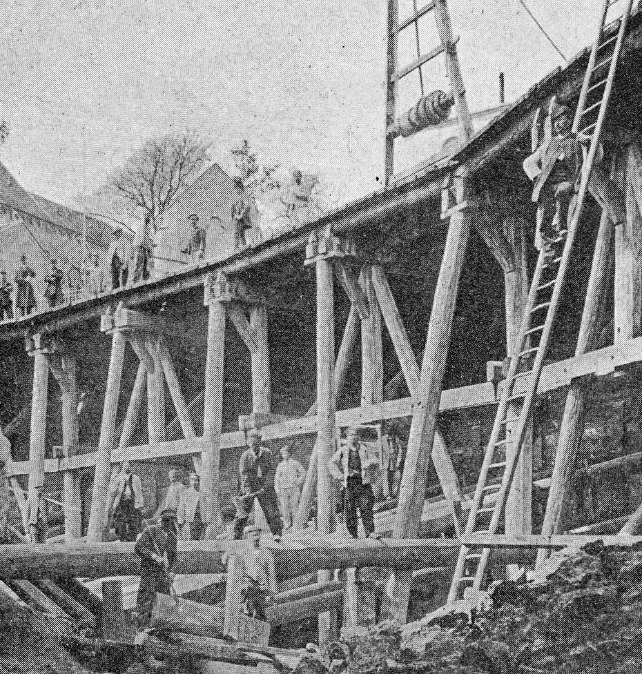 a black and white photo of a bridge
