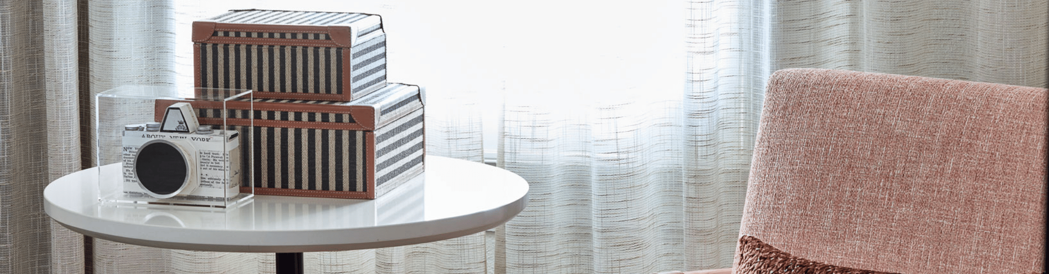 a white table with a striped box on it