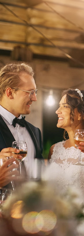 a table with glasses and flowers
