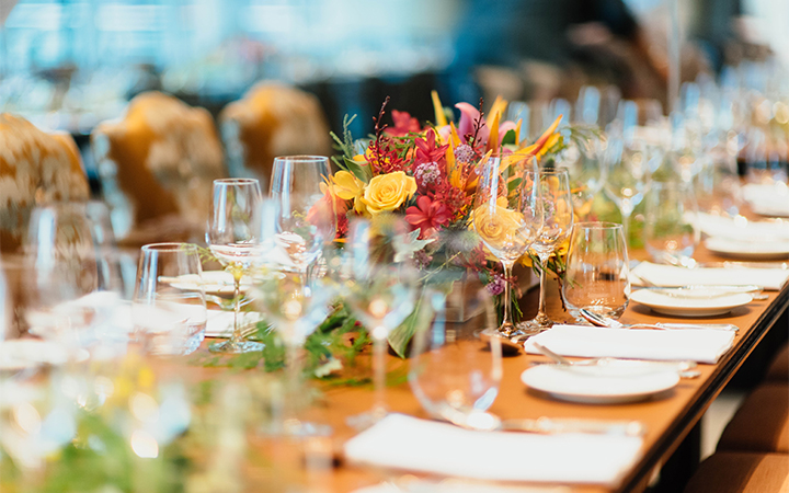 a table with glasses and flowers