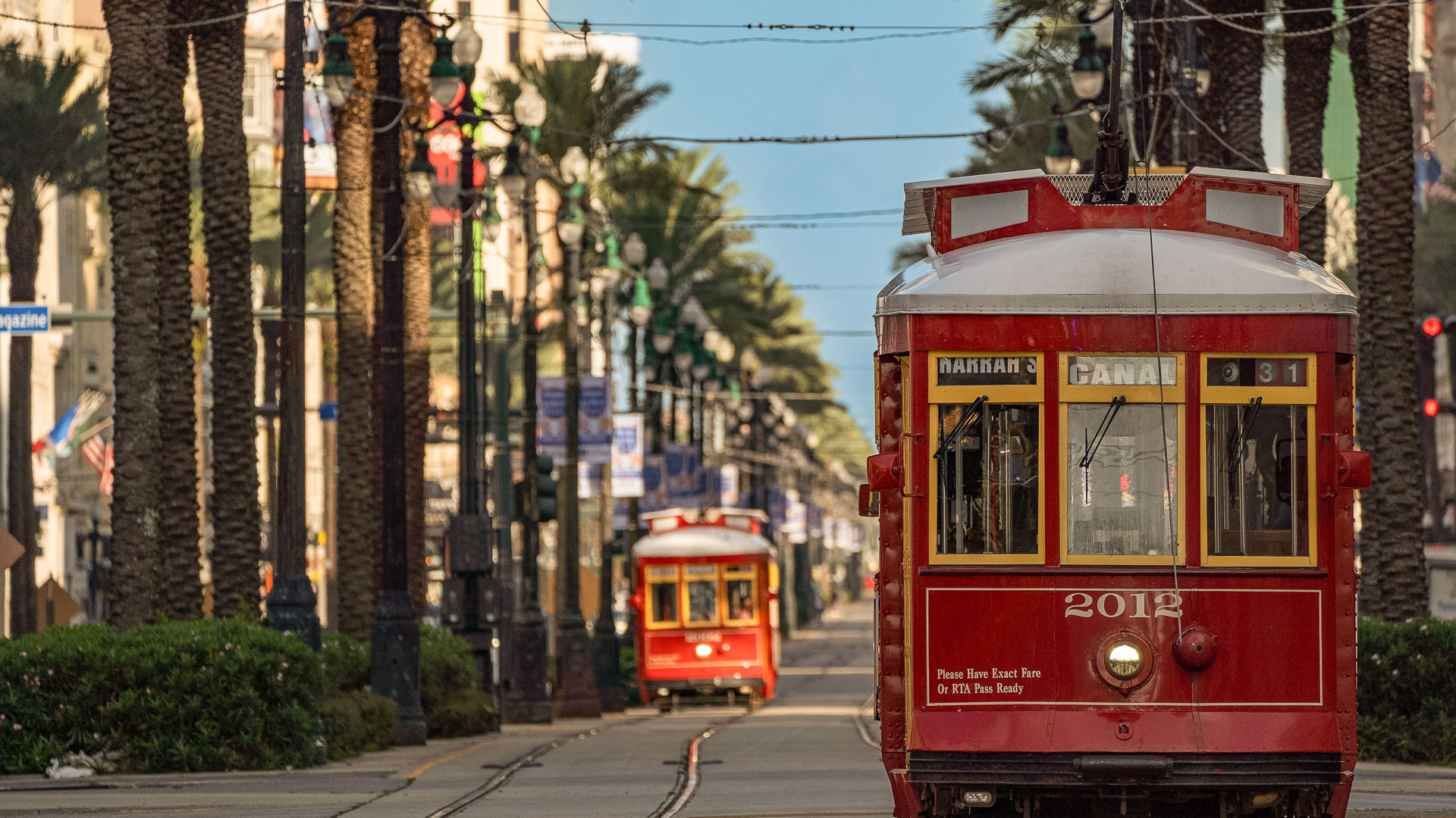 a red trolleys on a street