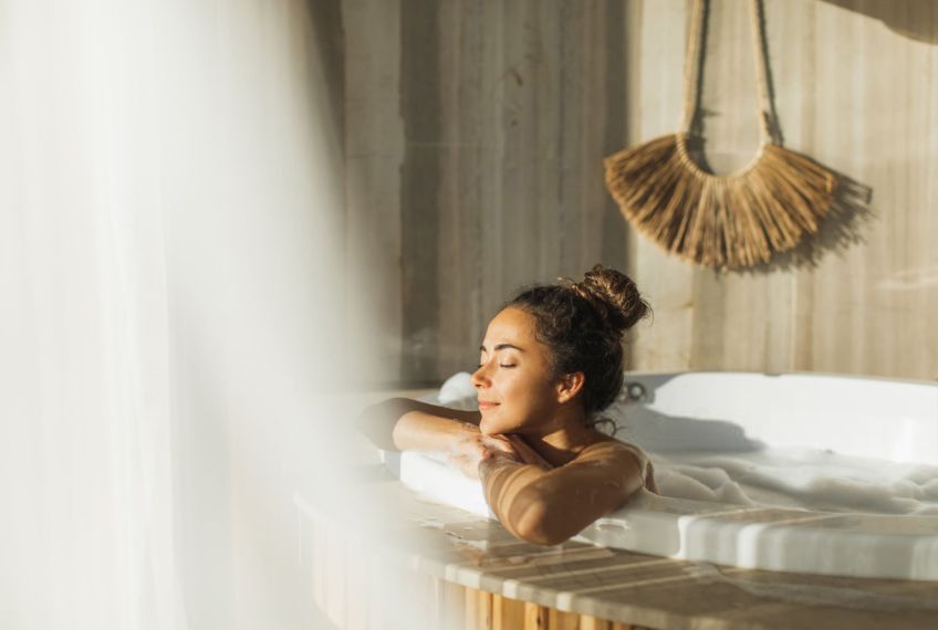 a person lying on a bed
