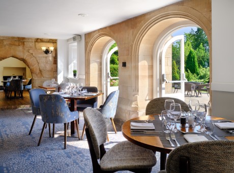 a restaurant with tables and chairs