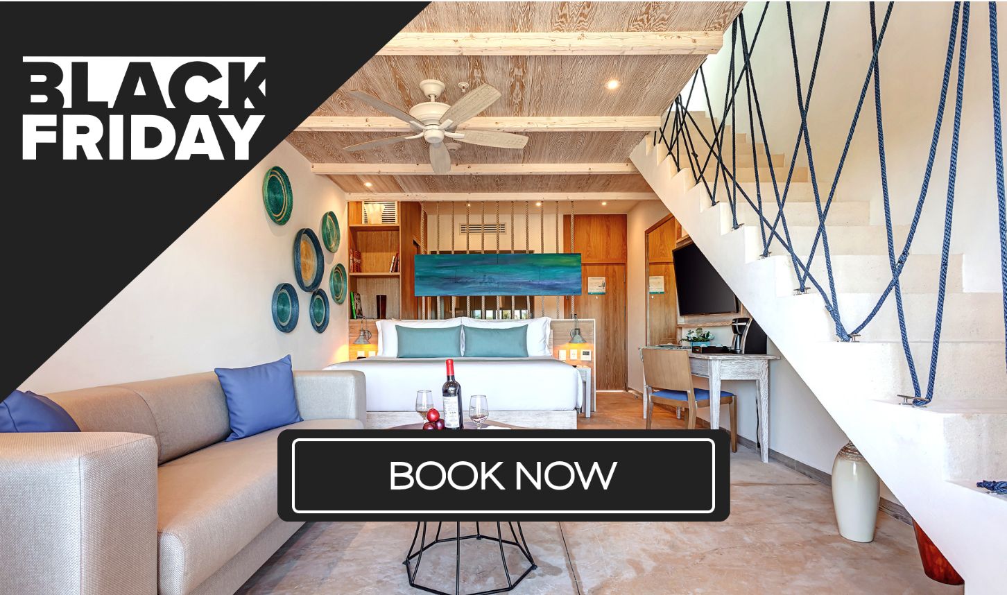 a room with a bed and a staircase