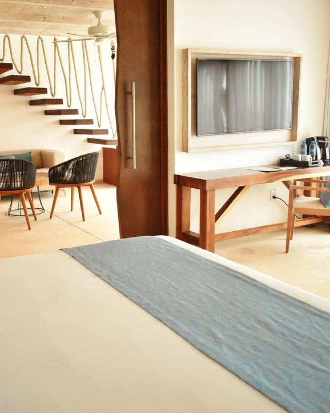 a room with a television and a bed