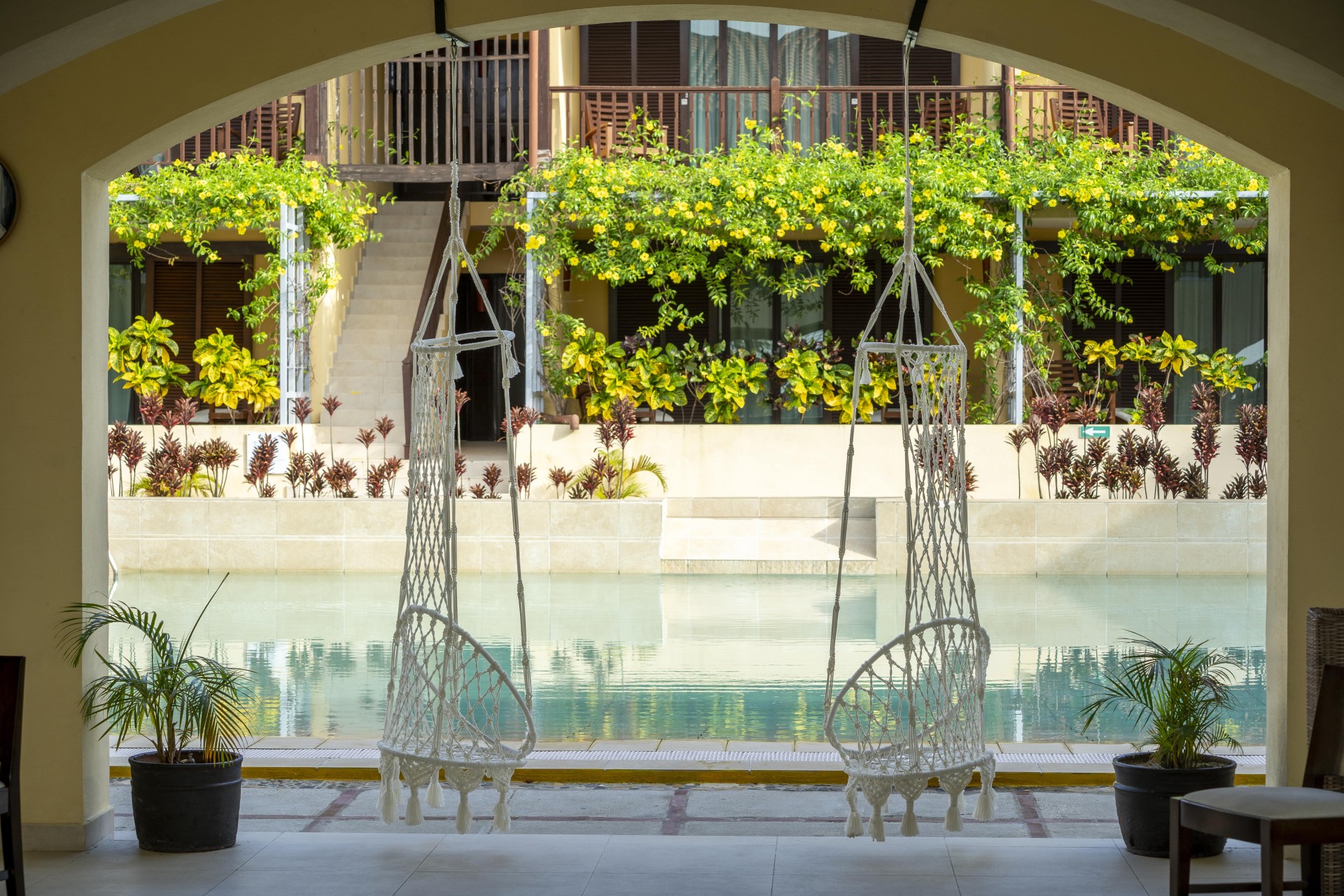 a white swing from a pool