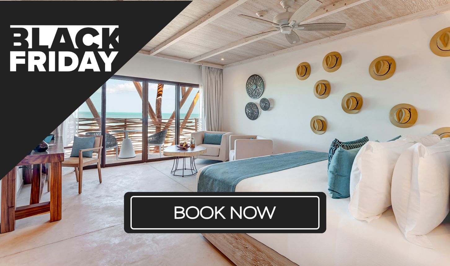 a room with a bed and chairs and a table