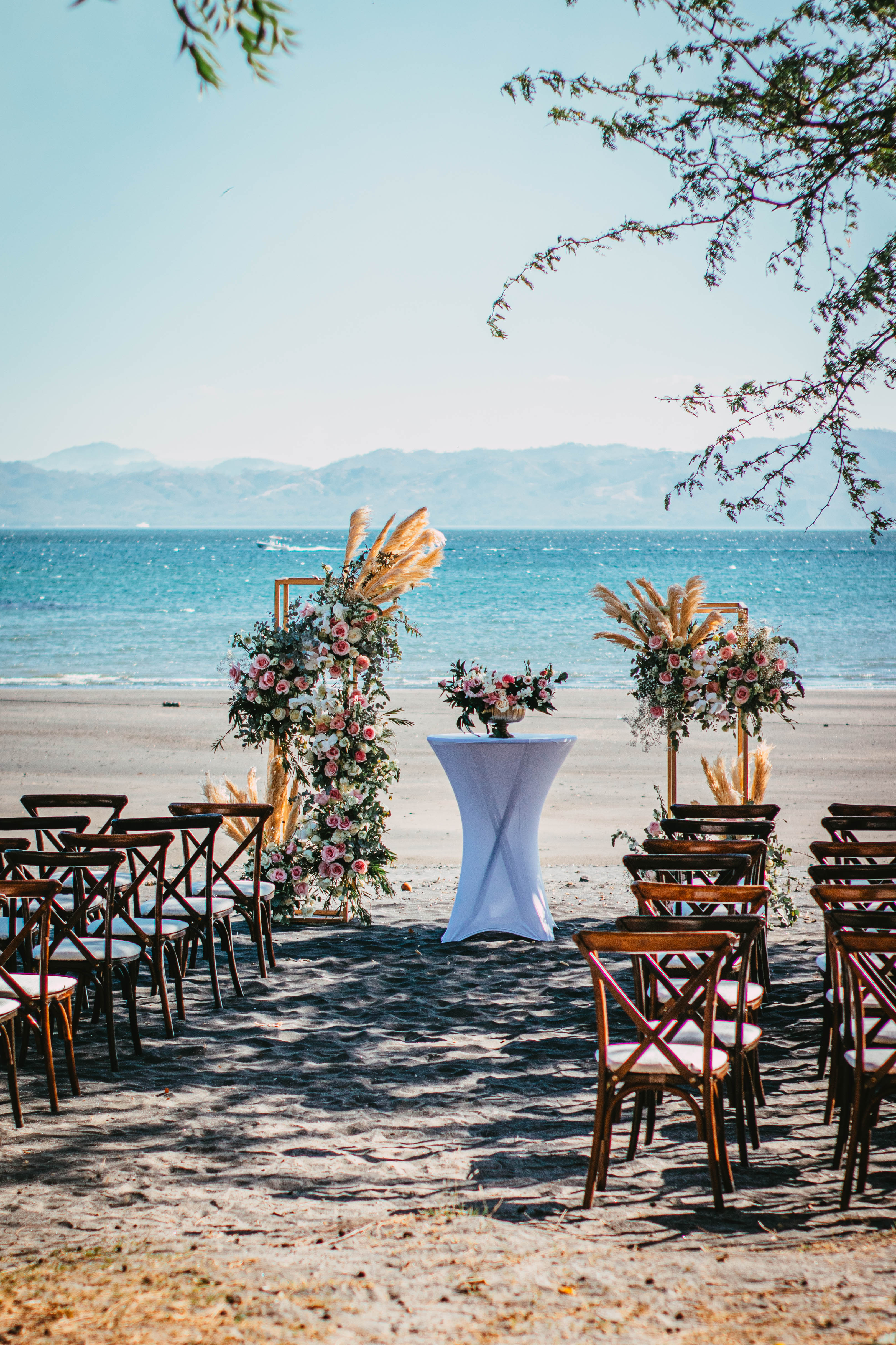 a wedding ceremony set up on a beach