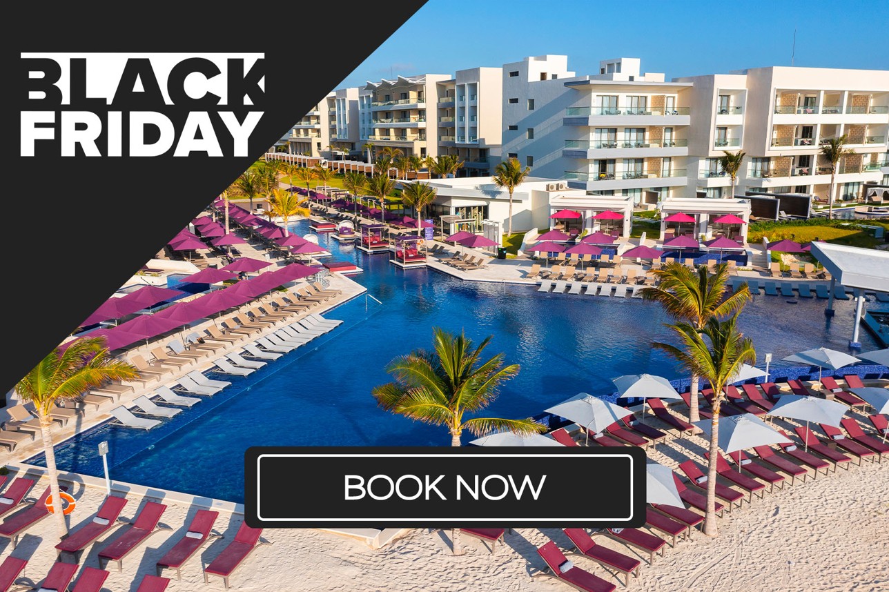 a pool with umbrellas and chairs and palm trees