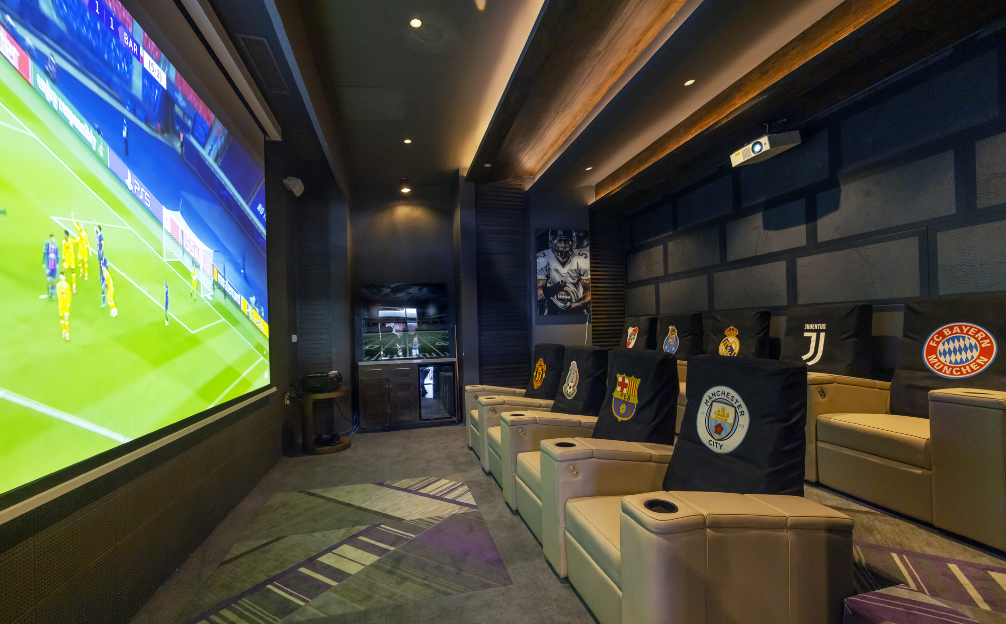 a room with chairs and a large screen