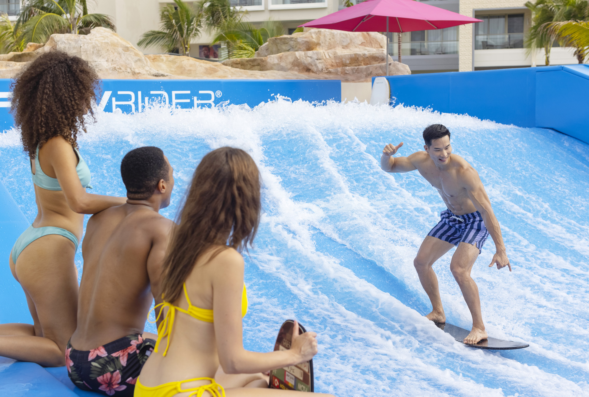 a man on a surfboard in a pool