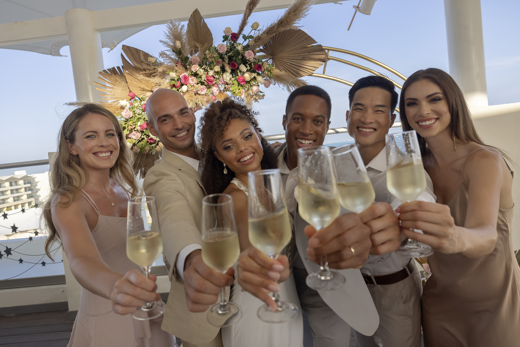 a group of people holding champagne glasses