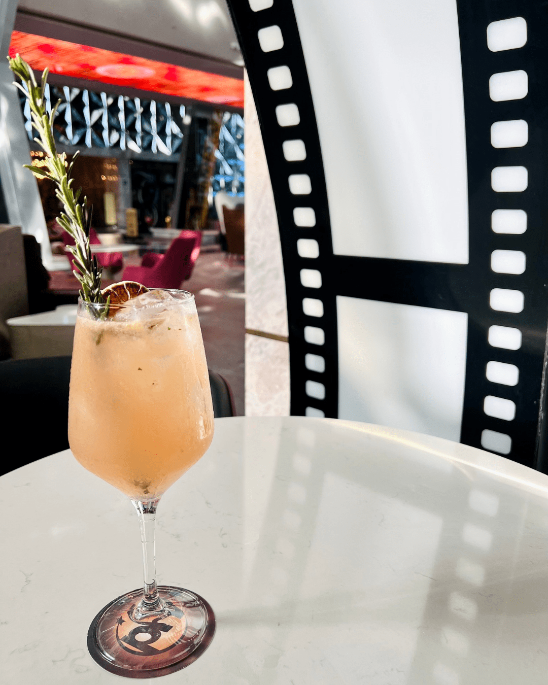 a glass of drink on a table