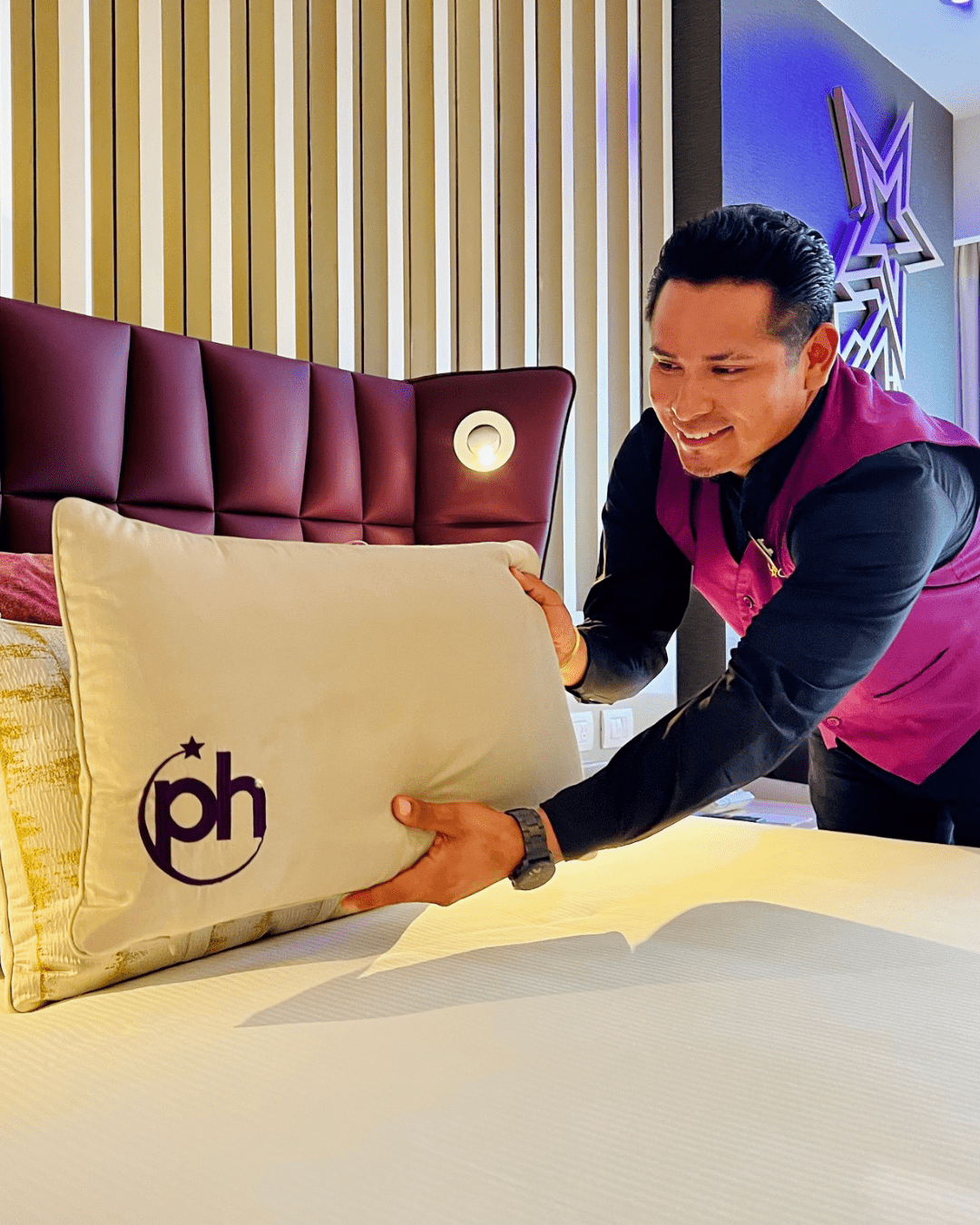 a man holding a pillow
