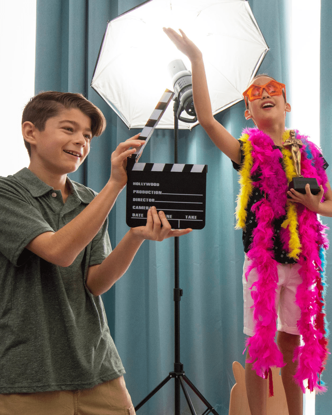a boy and girl posing for a photo