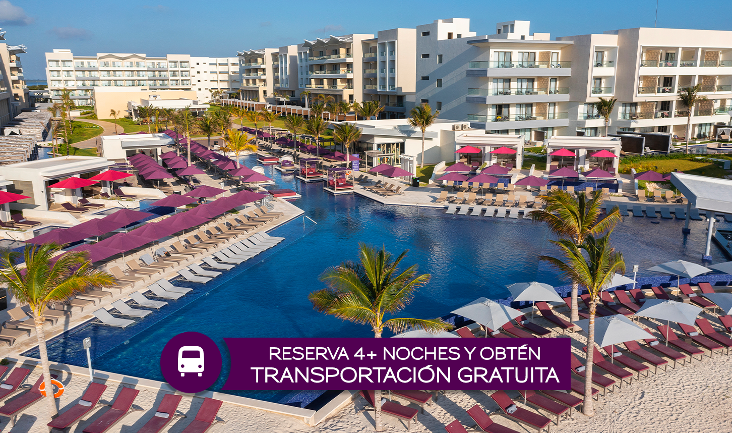 a pool with lounge chairs and umbrellas in a resort