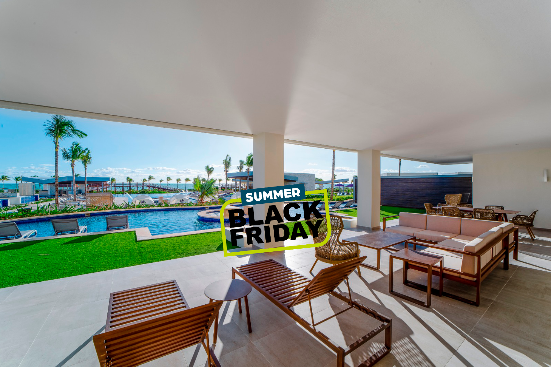 a patio with chairs and a pool in the background