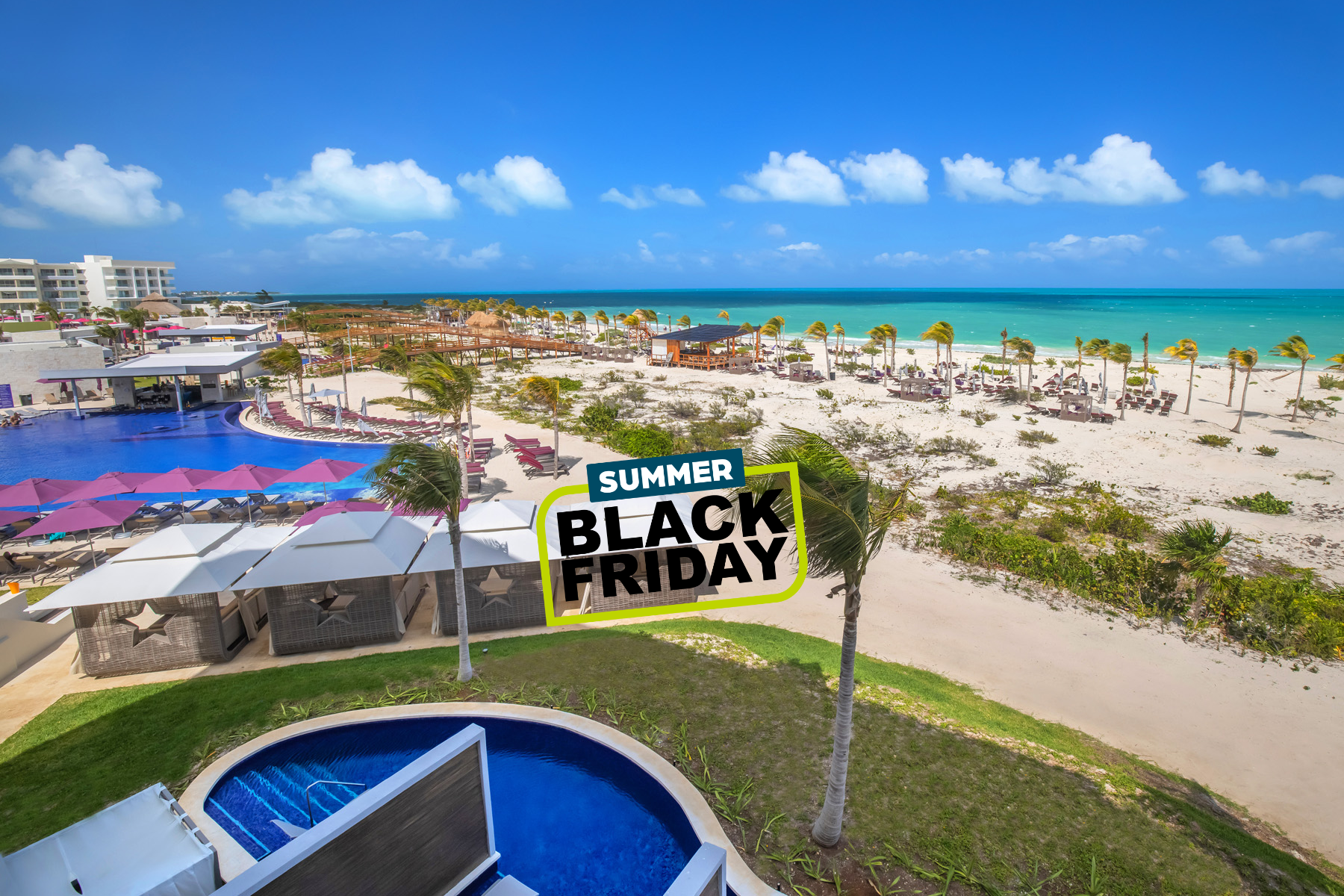 a pool on a beach with palm trees and people on the beach