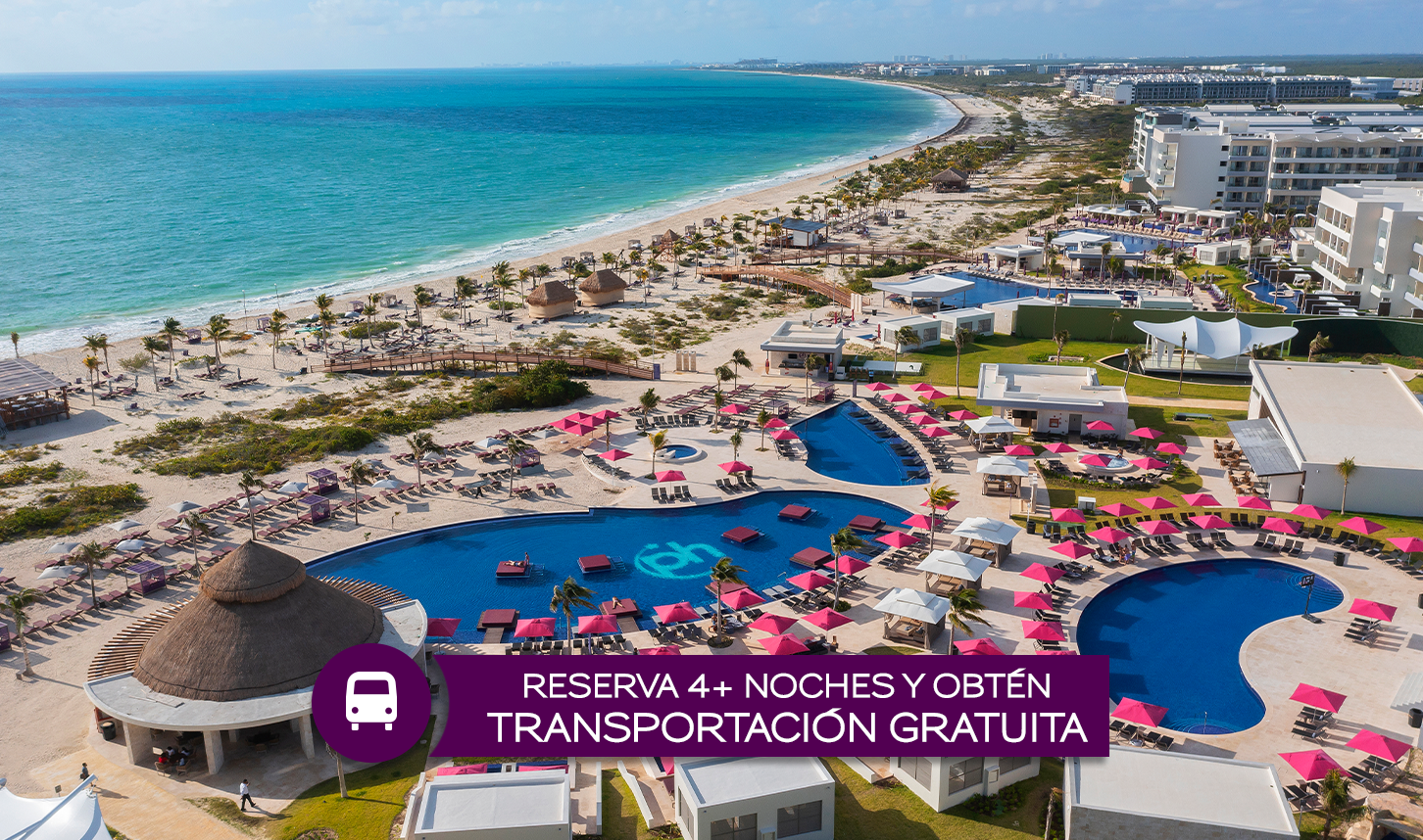 a beach with a swimming pool and umbrellas