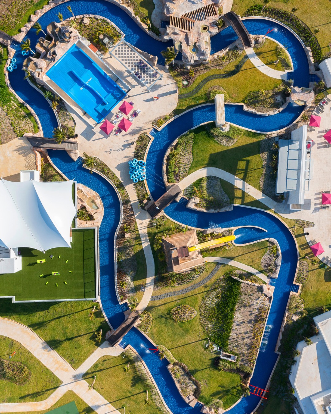 a water park with a pool and a slide