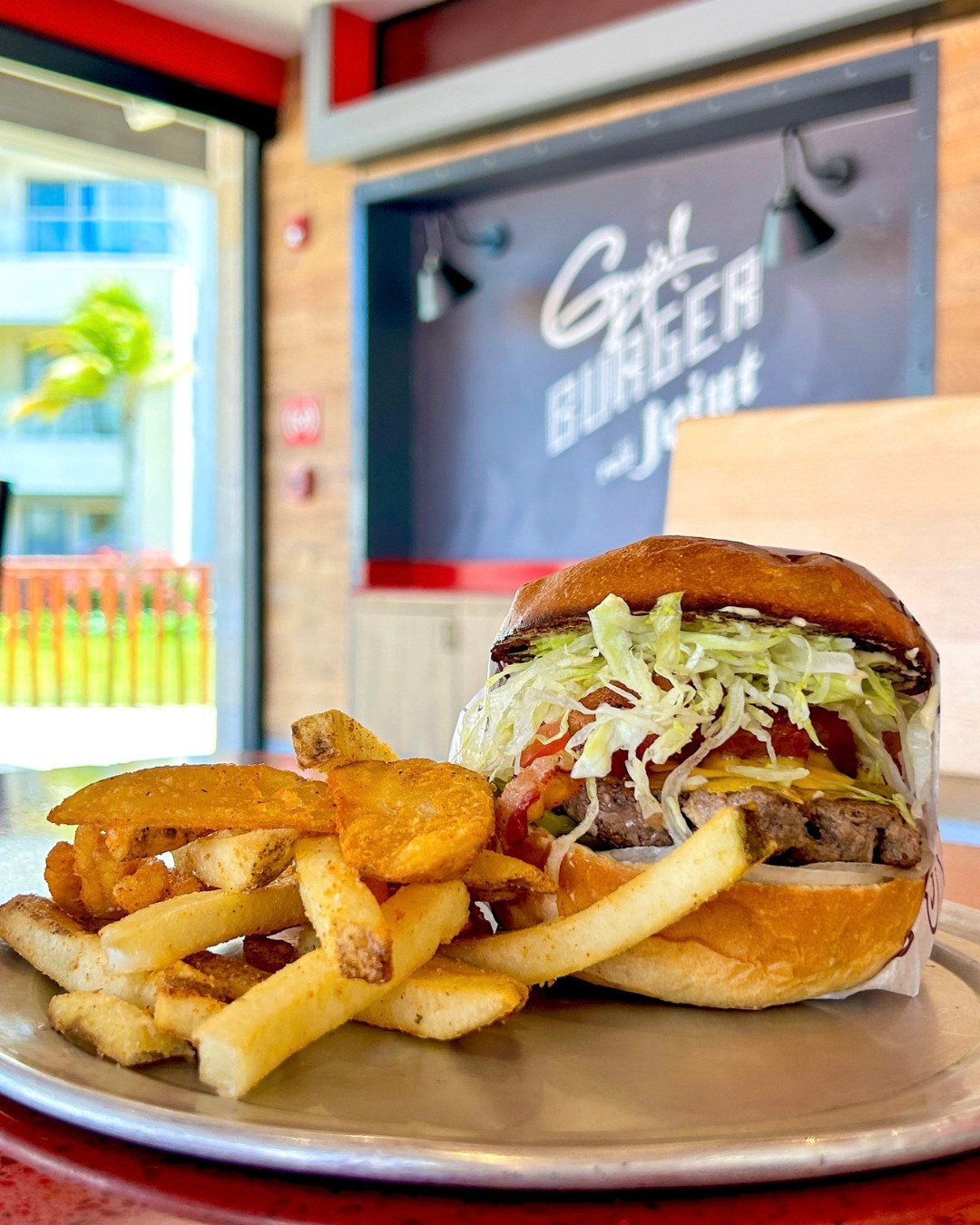 a burger and fries on a plate