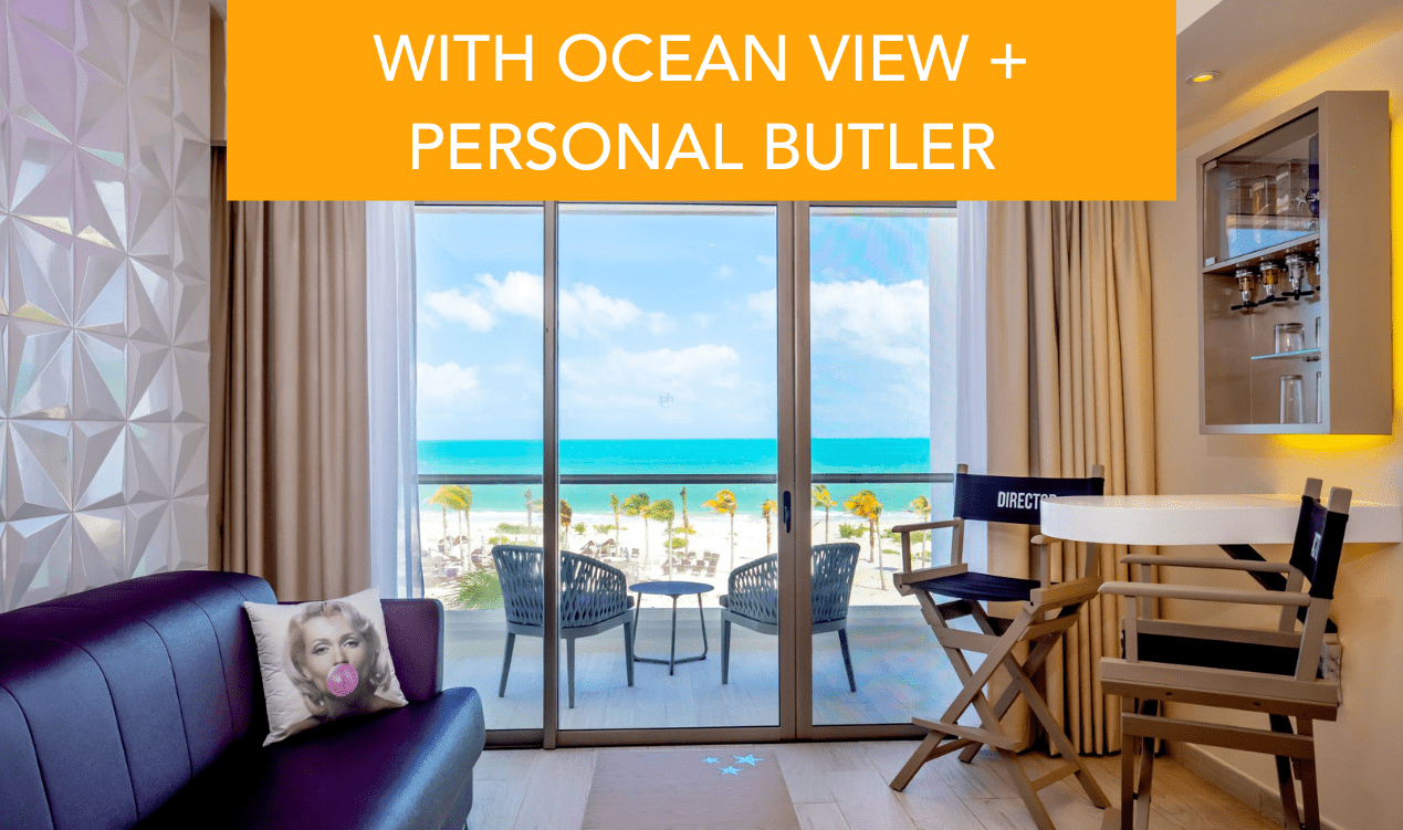 a room with a view of the beach and chairs