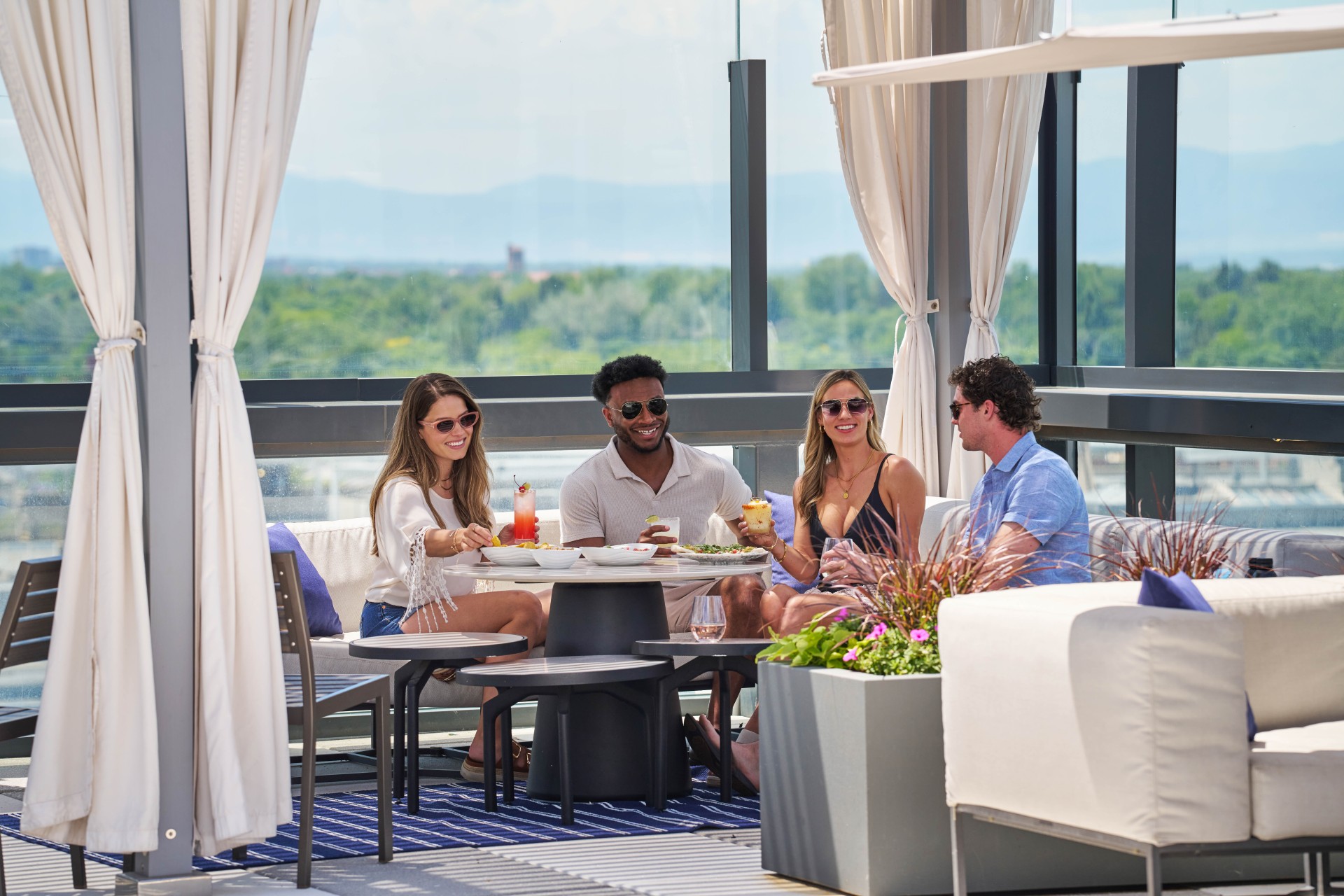 a group of people sitting at a table on the roof