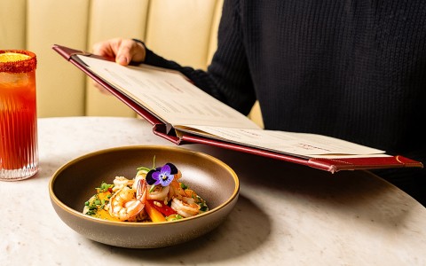 a person reading a menu