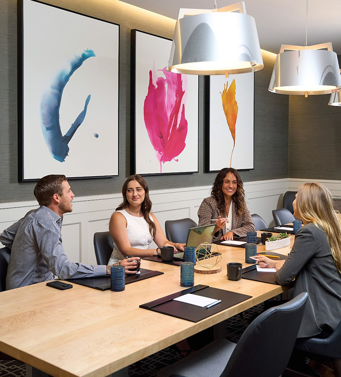 a group of people sitting around a table