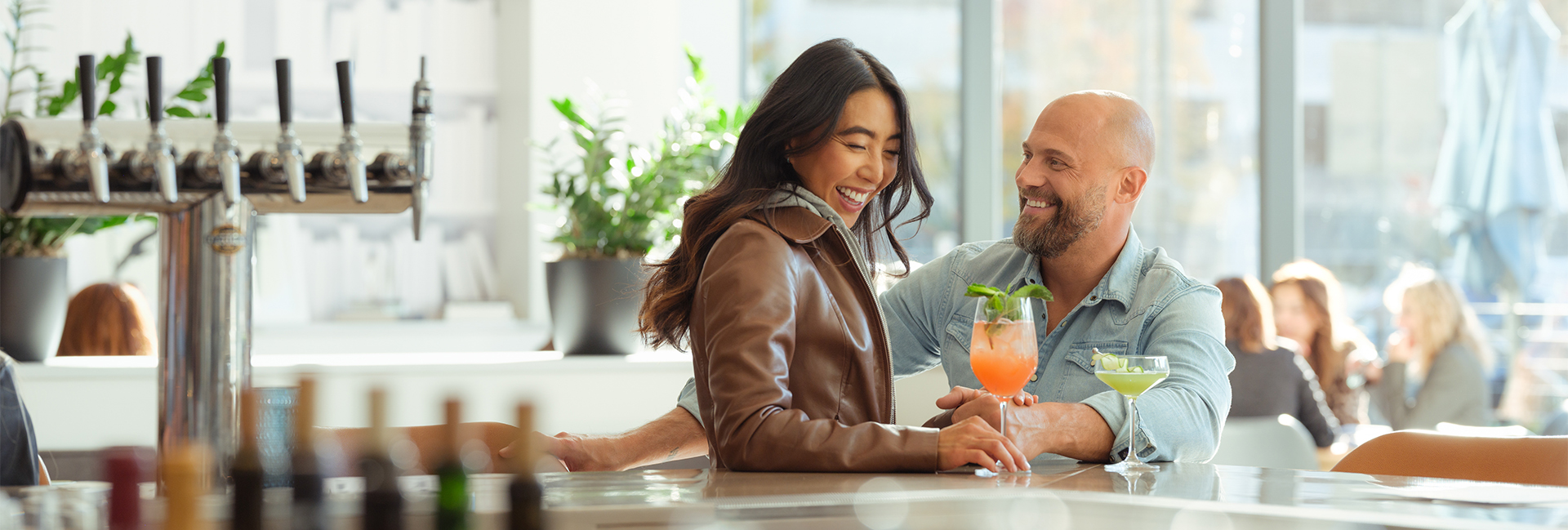 a man and woman smiling at each other