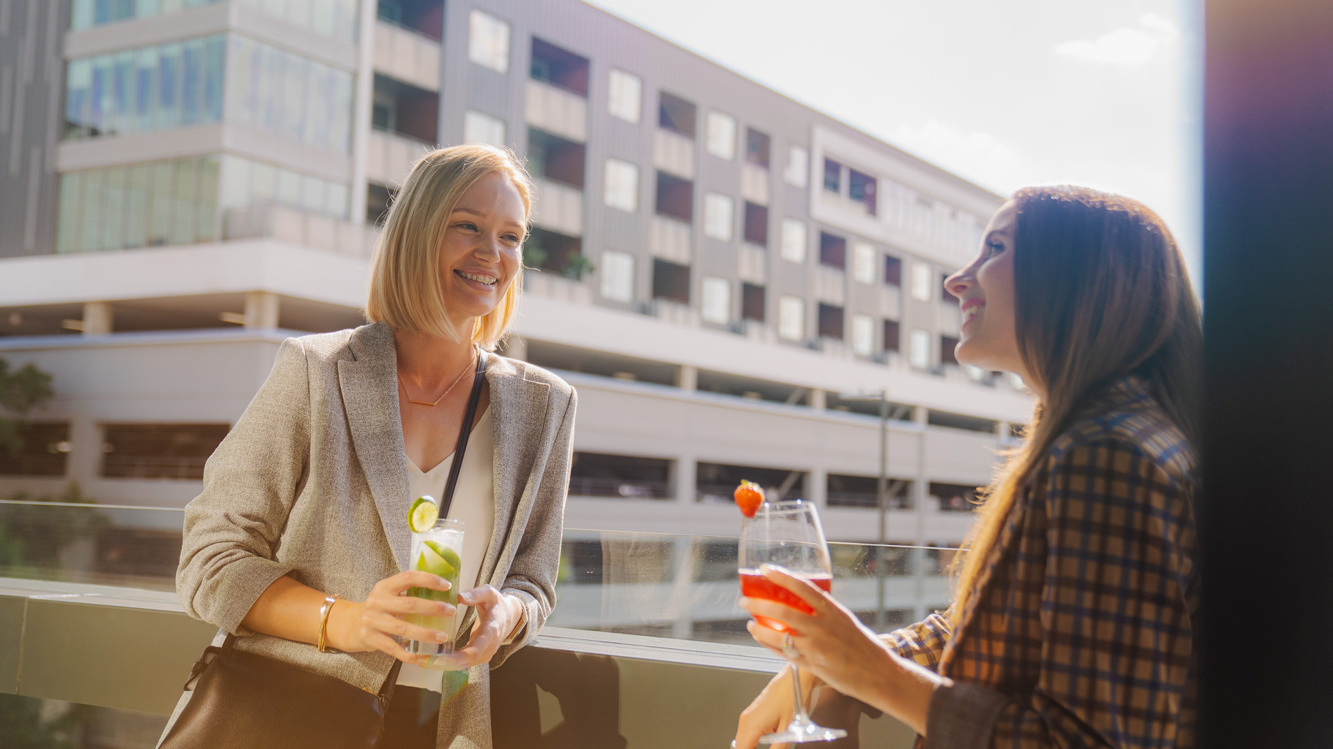 a group of women holding drinks