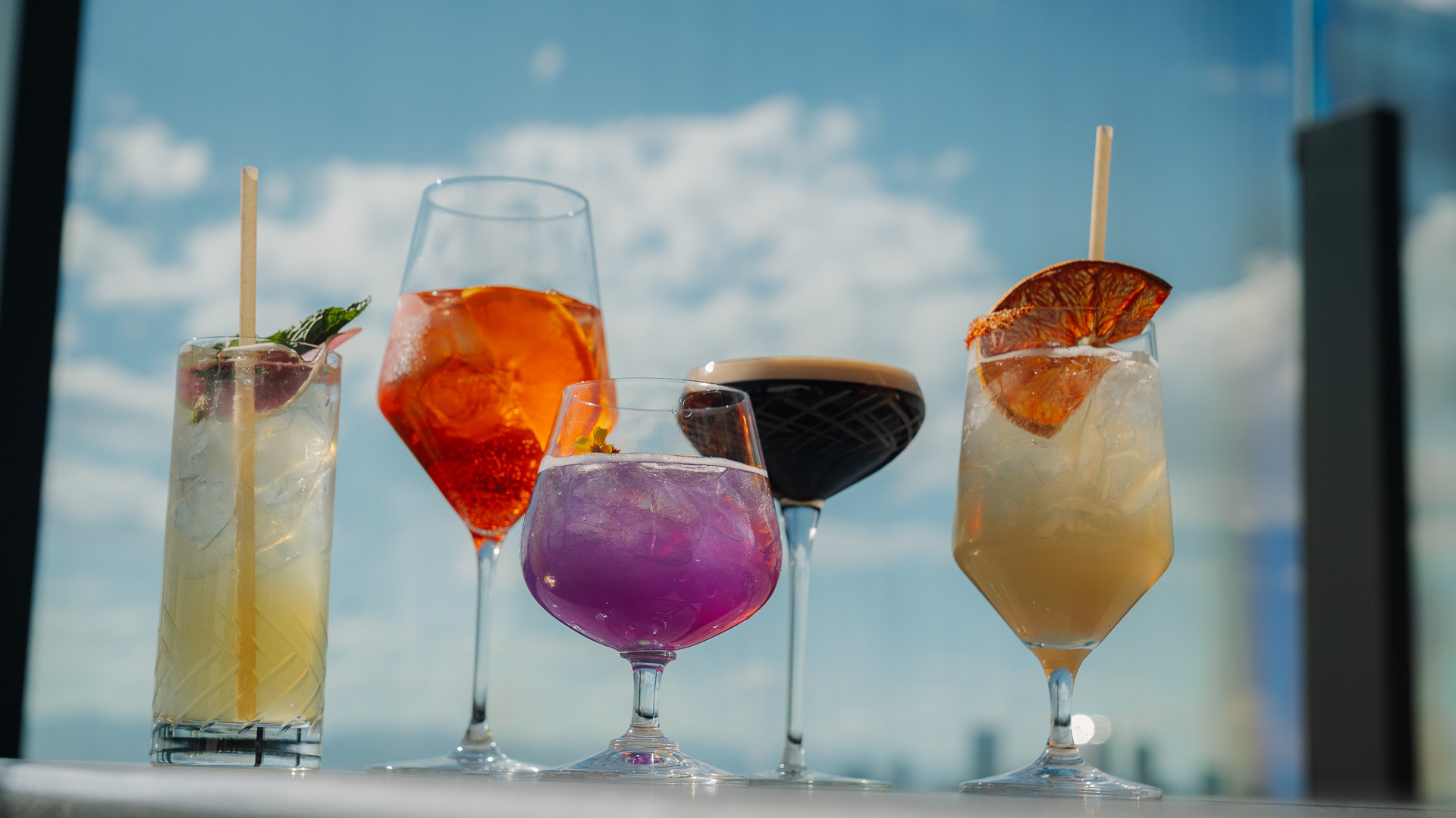 a group of different colored drinks