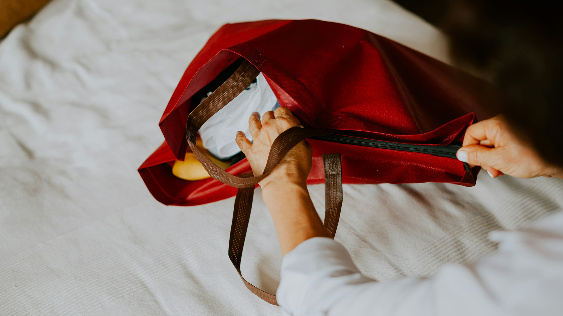 a hand holding a bag