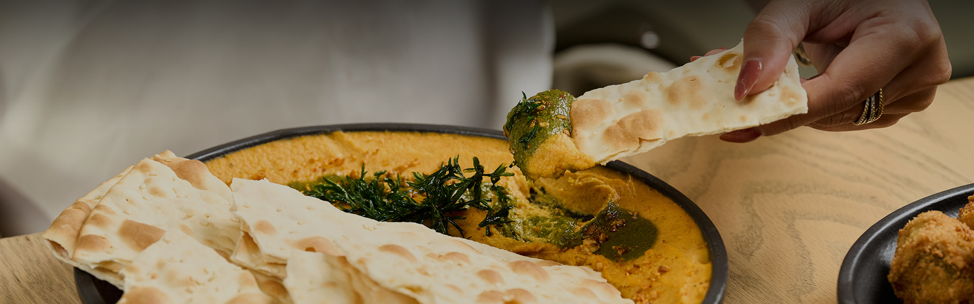 a dip in a bowl of food