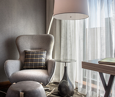 a chair and a lamp in a room