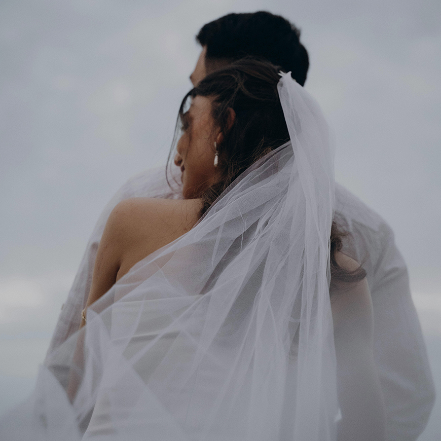 a man and woman in a white dress