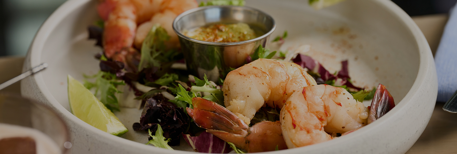 a plate of shrimp and salad