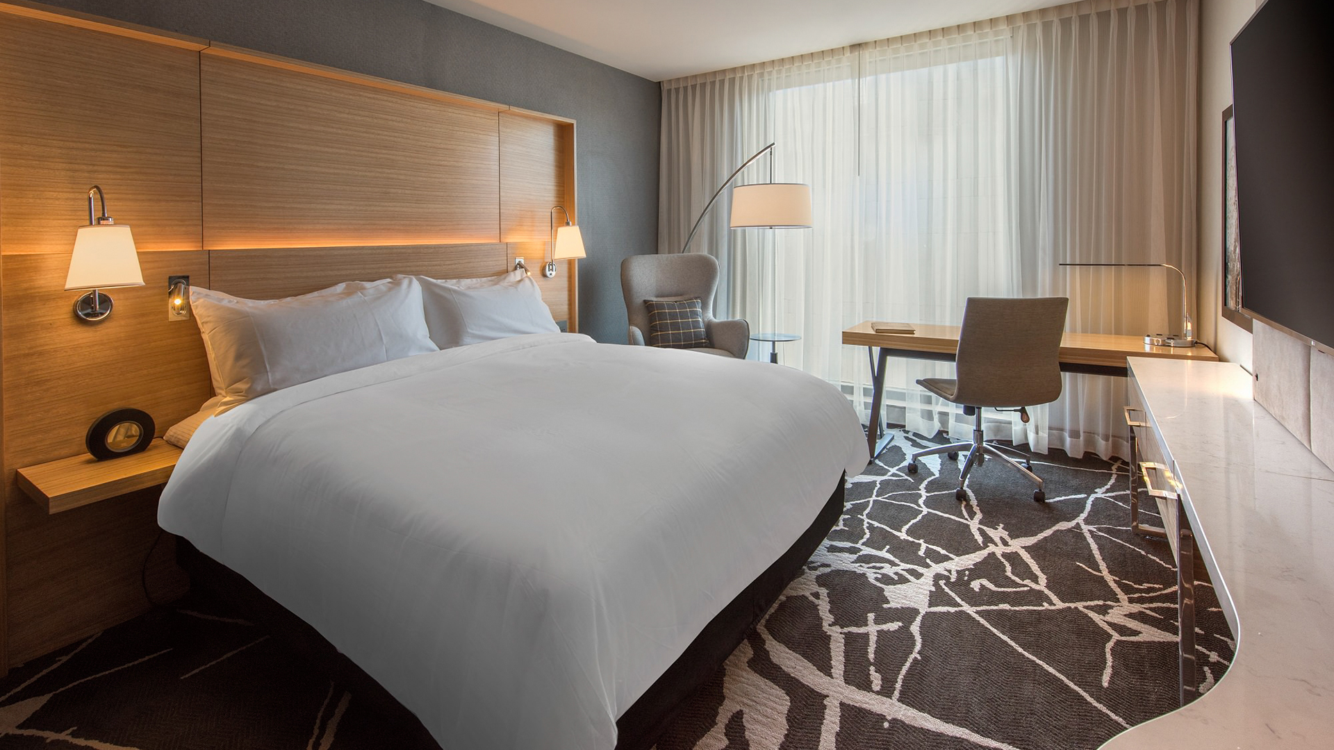 a room with a bed and a desk main