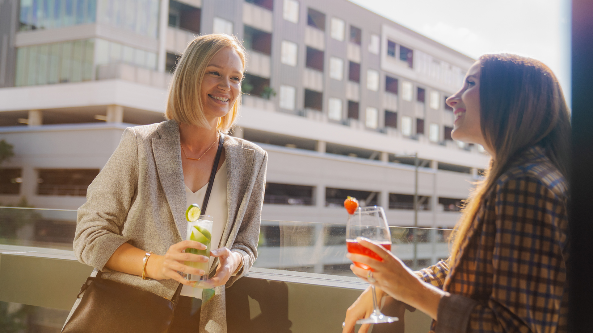 a group of women holding drinks main