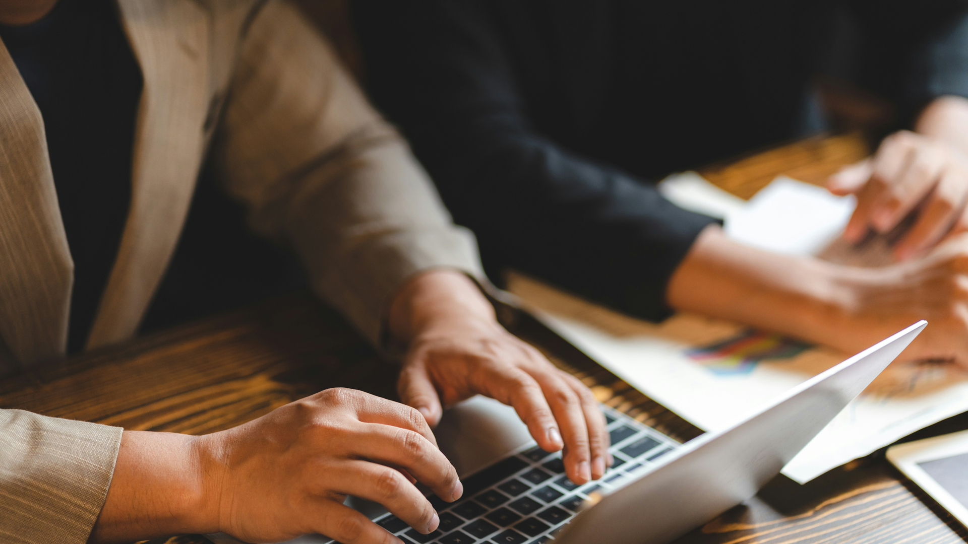 a person typing on a laptop main