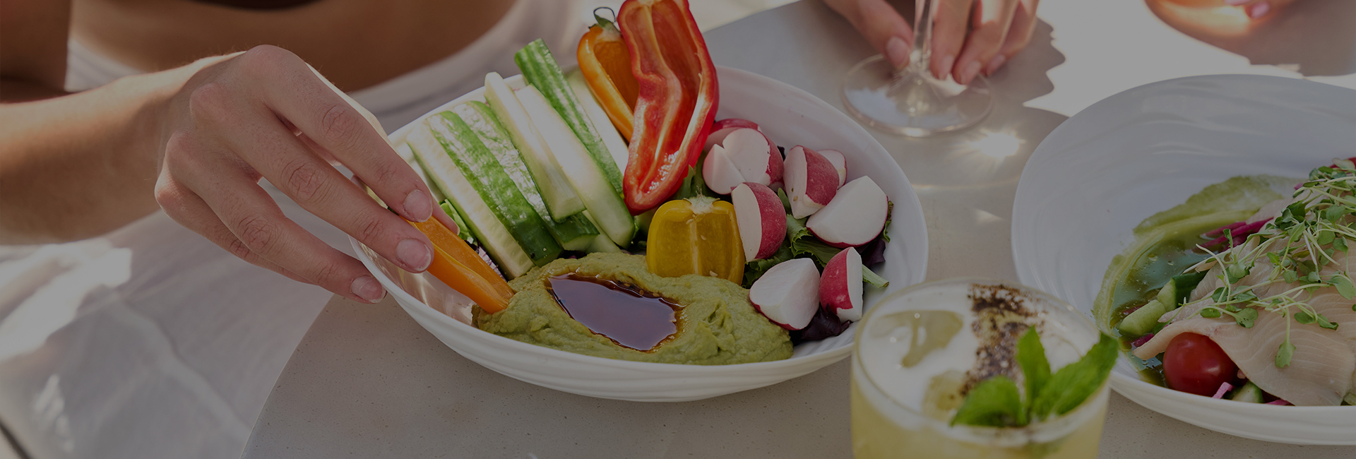 a bowl of vegetables and dip